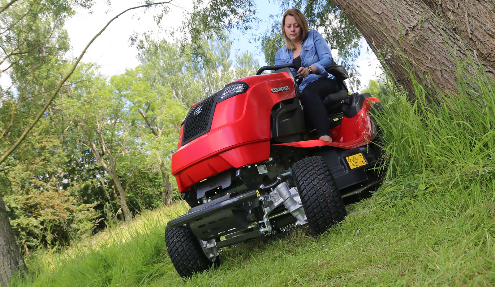 Countax B Series 4WD garden tractor ride on mower with HGM cutter deck cutting around tree
