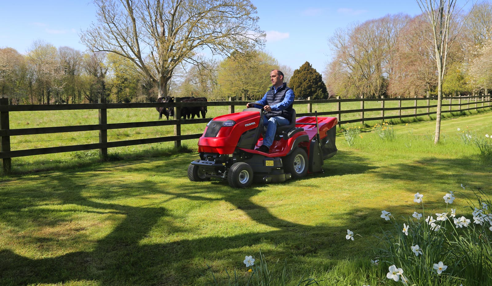 countax-garden-tractor-cseries-collecting-grass-spring